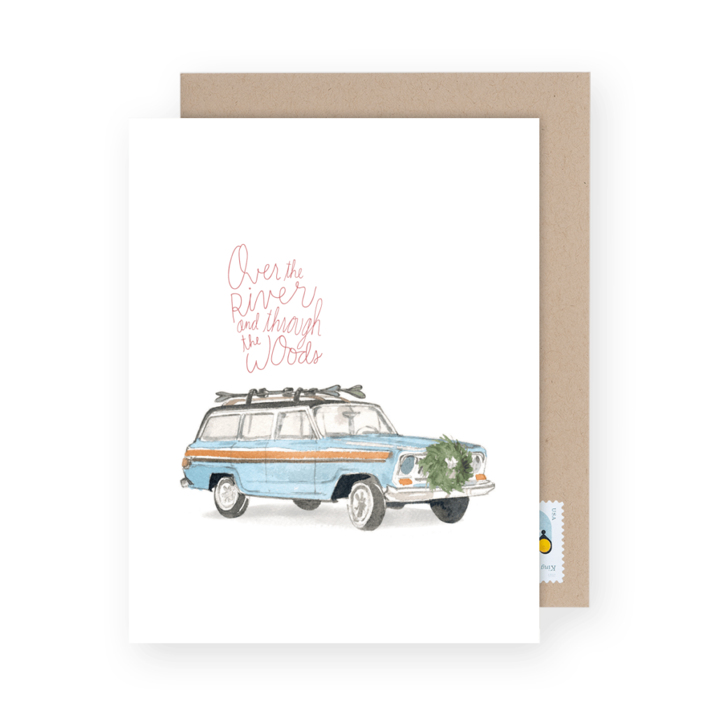 A greeting card with an illustration of a blue vintage station wagon carrying a wreath, with the text "Over the river and through the woods.