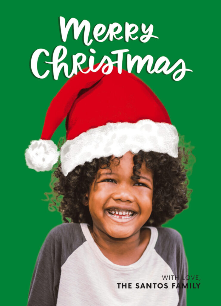 Child wearing a Santa hat smiles against a green background with the text "Merry Christmas" above and "With love, the Santos family" below.