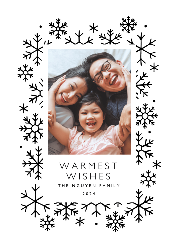 Family of three smiling and embracing each other on a holiday card with the text "Warmest Wishes, The Nguyen Family, 2024.