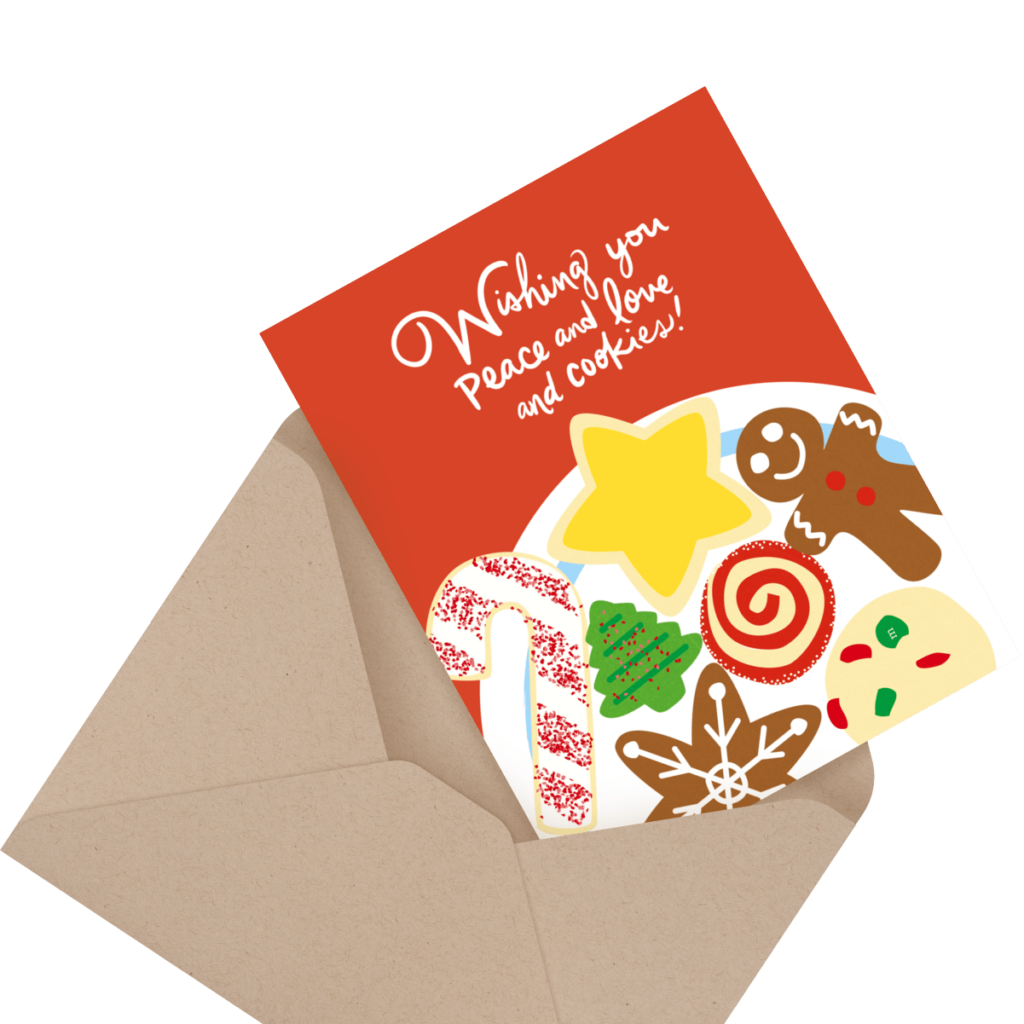 A holiday card with cookies illustration and the text "Wishing you peace and love and cookies!" is partially inside a brown envelope.