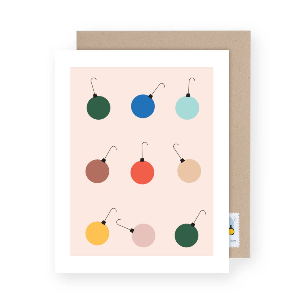 Illustration of a greeting card featuring nine minimalist ornament designs in various colors, with a brown envelope partially visible behind it.