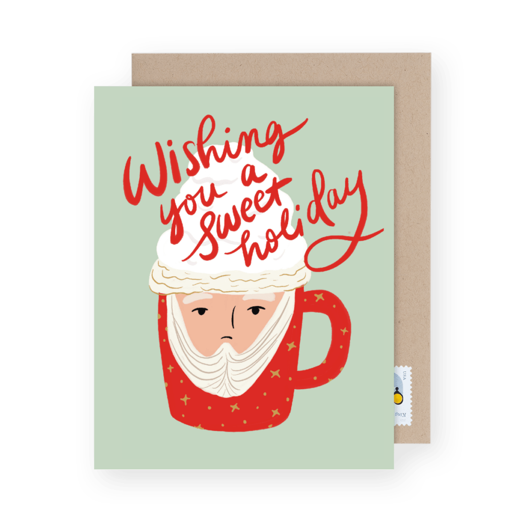 Holiday card featuring a red mug with Santa's face, whipped cream, and the text "Wishing you a sweet holiday to give during a fun Christmas game.