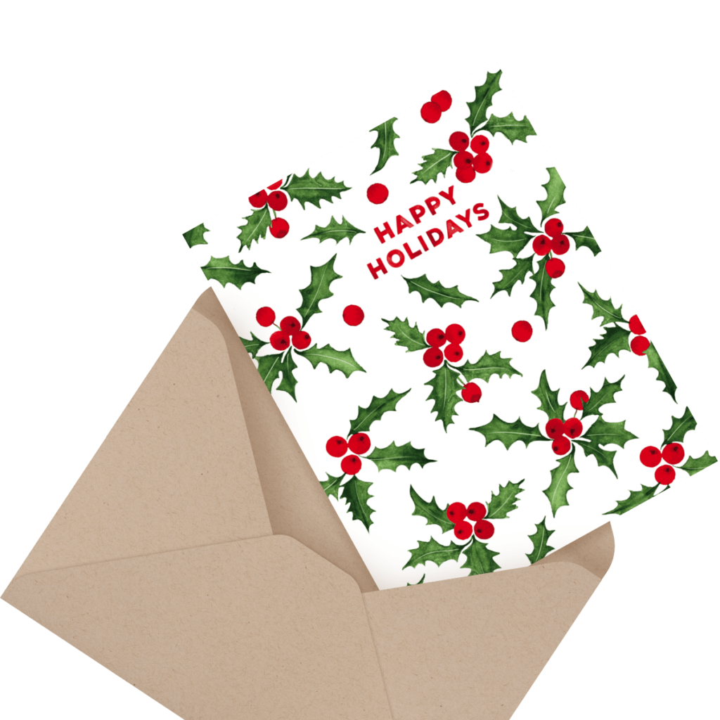 A holiday card with holly and red berries design, reading "Happy Holidays," partially inserted in a brown envelope.