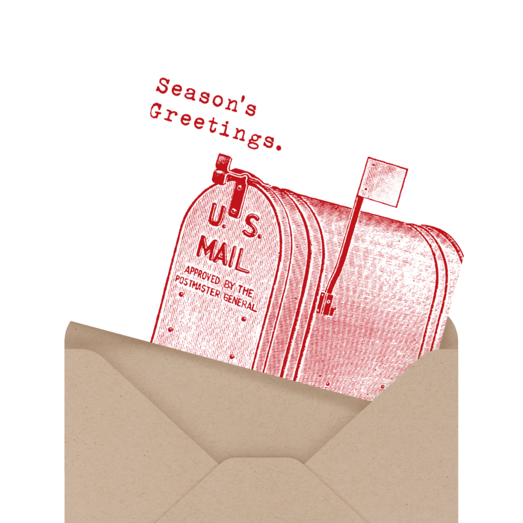 A greeting card featuring a red illustration of a U.S. mailbox with the text "Season's Greetings" is partially inserted into a brown envelope.